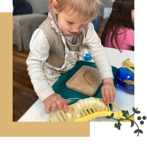 A toddler preparing a snack at John XXIII